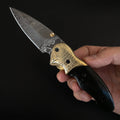 Canivete modelo artesanal com lâmina aço damasco e cabo de micarta.